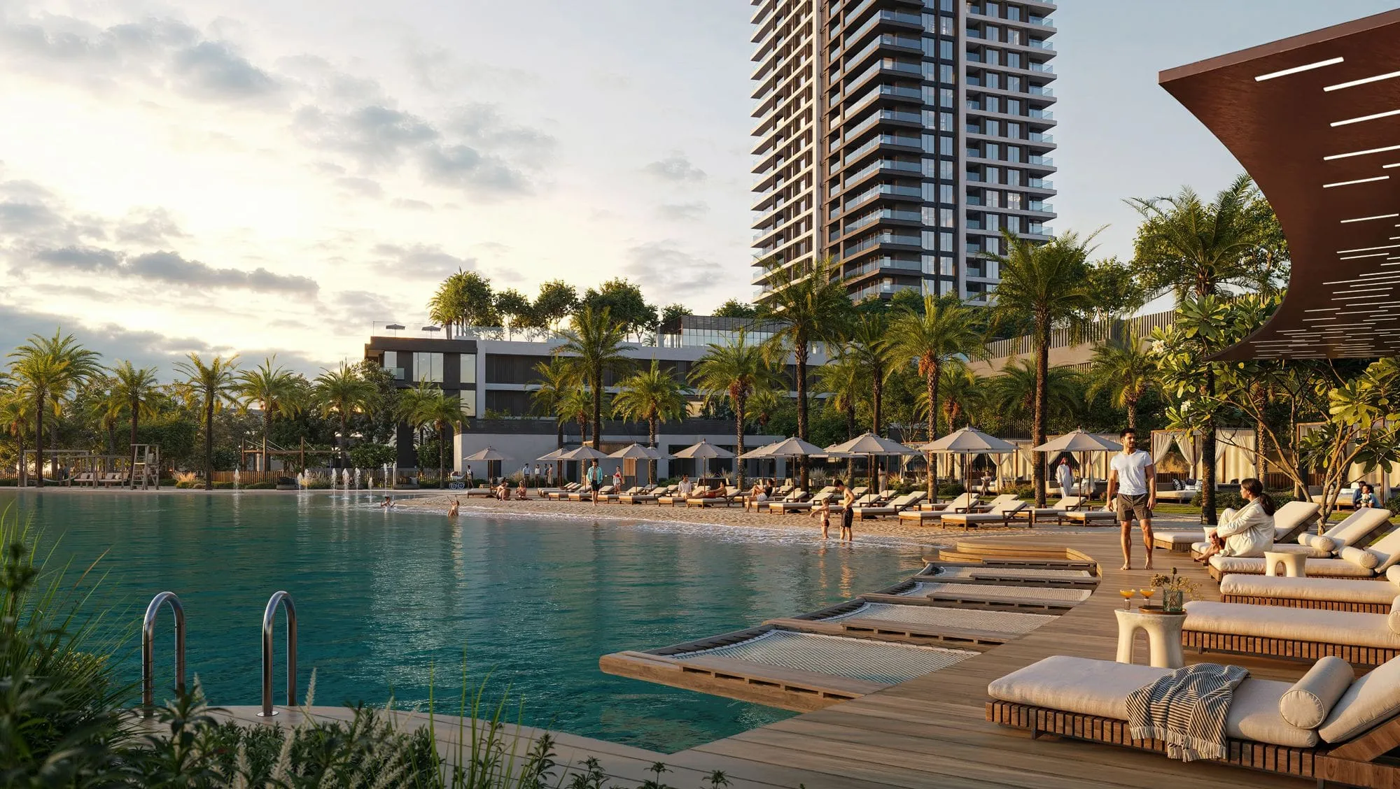 Lagoon and beach of the Palace Creek Blue residence at sunset