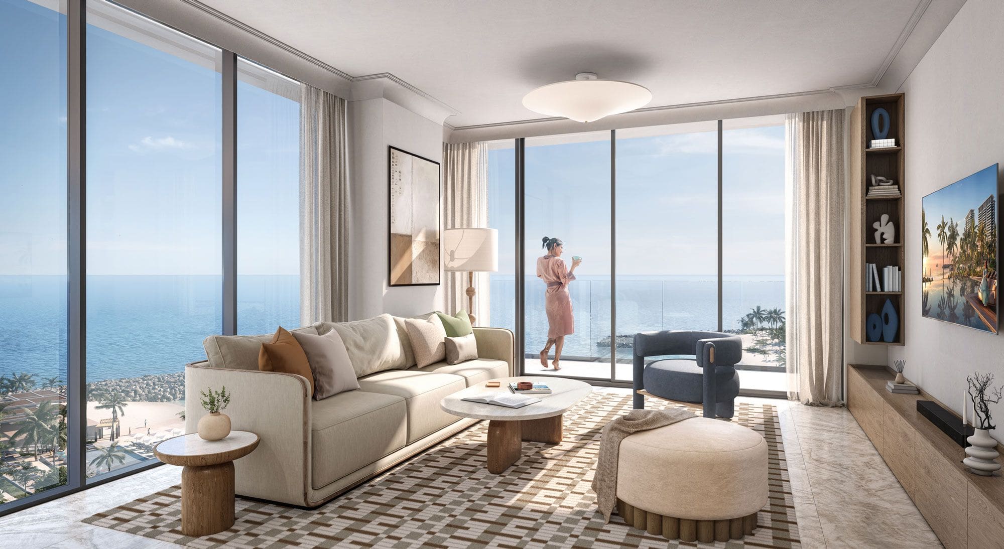 Corner living room with floor-to-ceiling glazing facing the Arabian Gulf